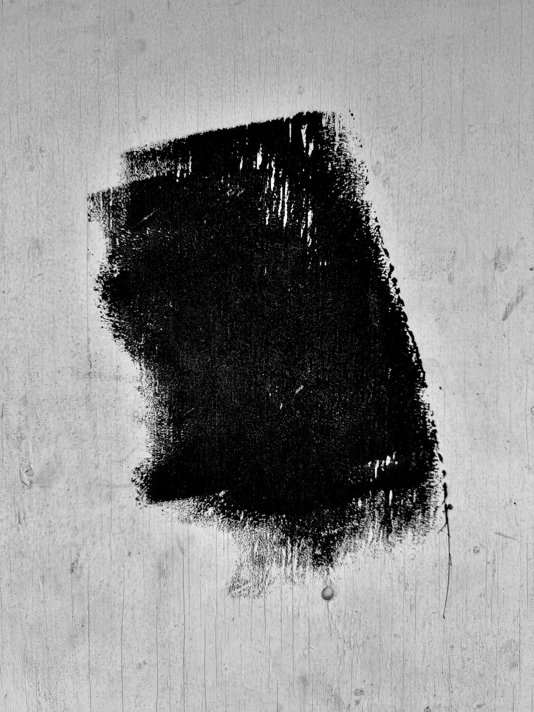 queen - glyph | LA - A high-contrast industrial noir photograph of paint strokes on a weathered urban wall. Fine art black-and-white photography, Los Angeles, California. 1/1 archival pigment print by Barton Caplan