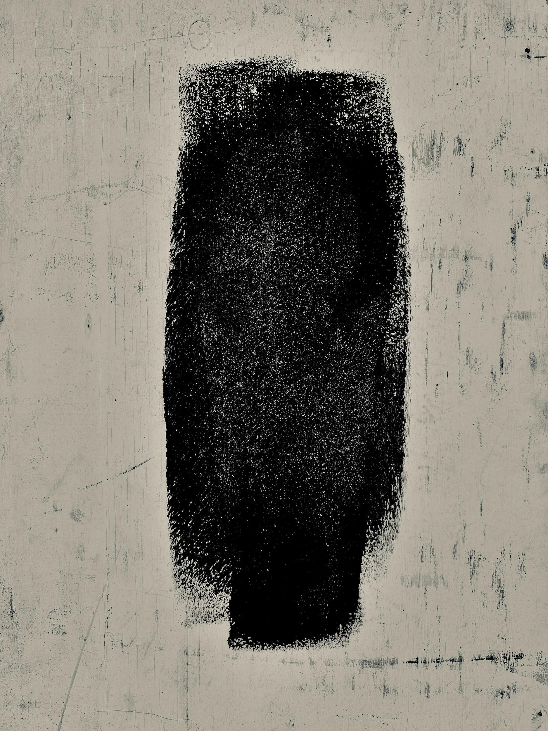 single - glyph | LA A singular, isolated black geometric mark centered on a grit-textured urban backdrop. Industrial noir black-and-white photography, Los Angeles, California. 1/1 archival pigment print by Barton Caplan